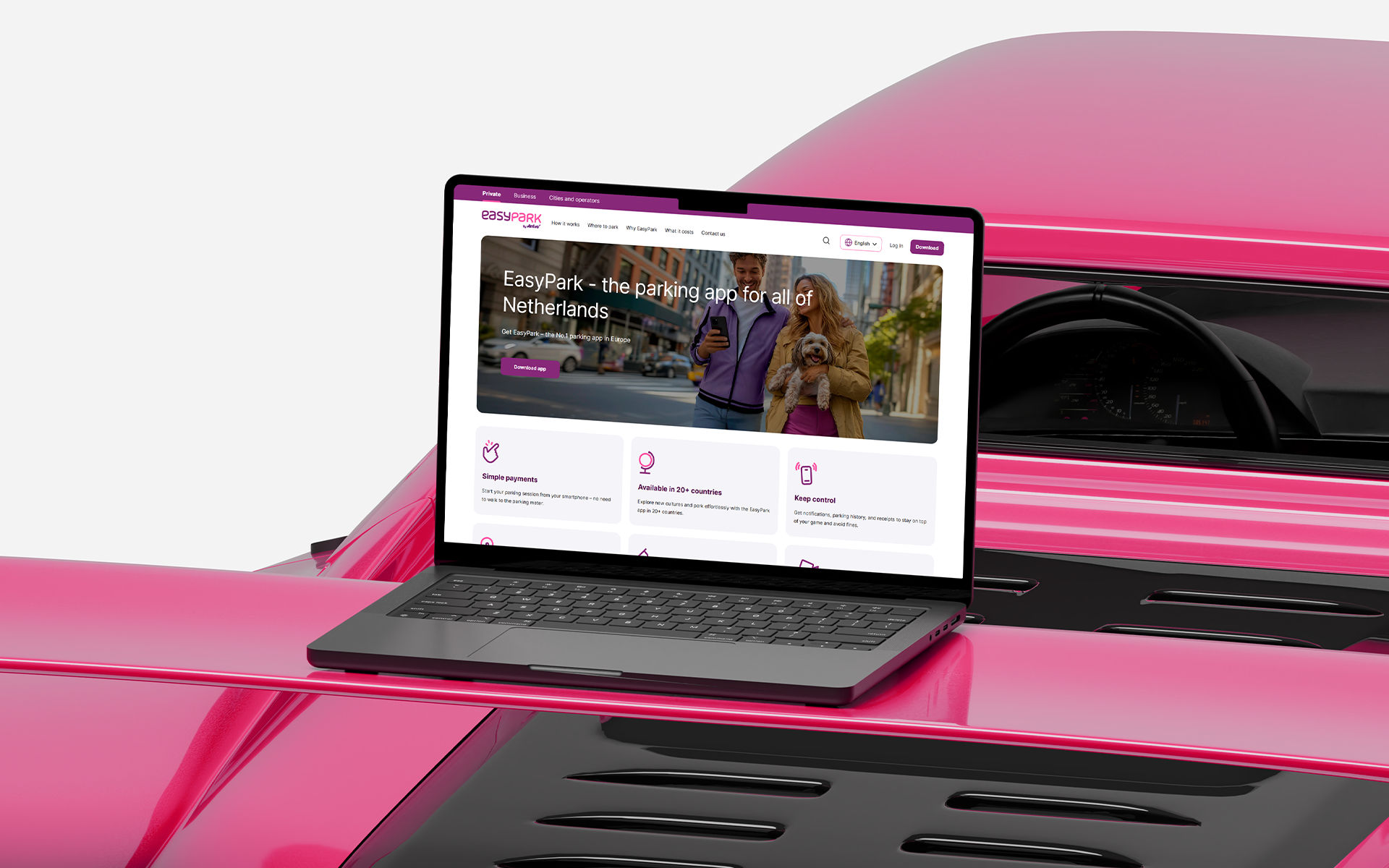 Laptop on pink surface showing EasyPark website with colorful hero section