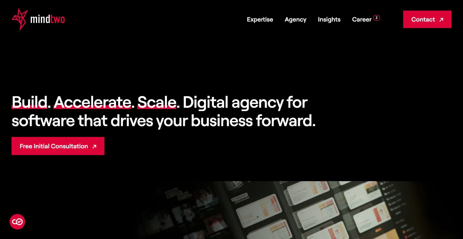 Mindtwo agency homepage with bold slogan about building, accelerating, scaling digital software and a consultation button
