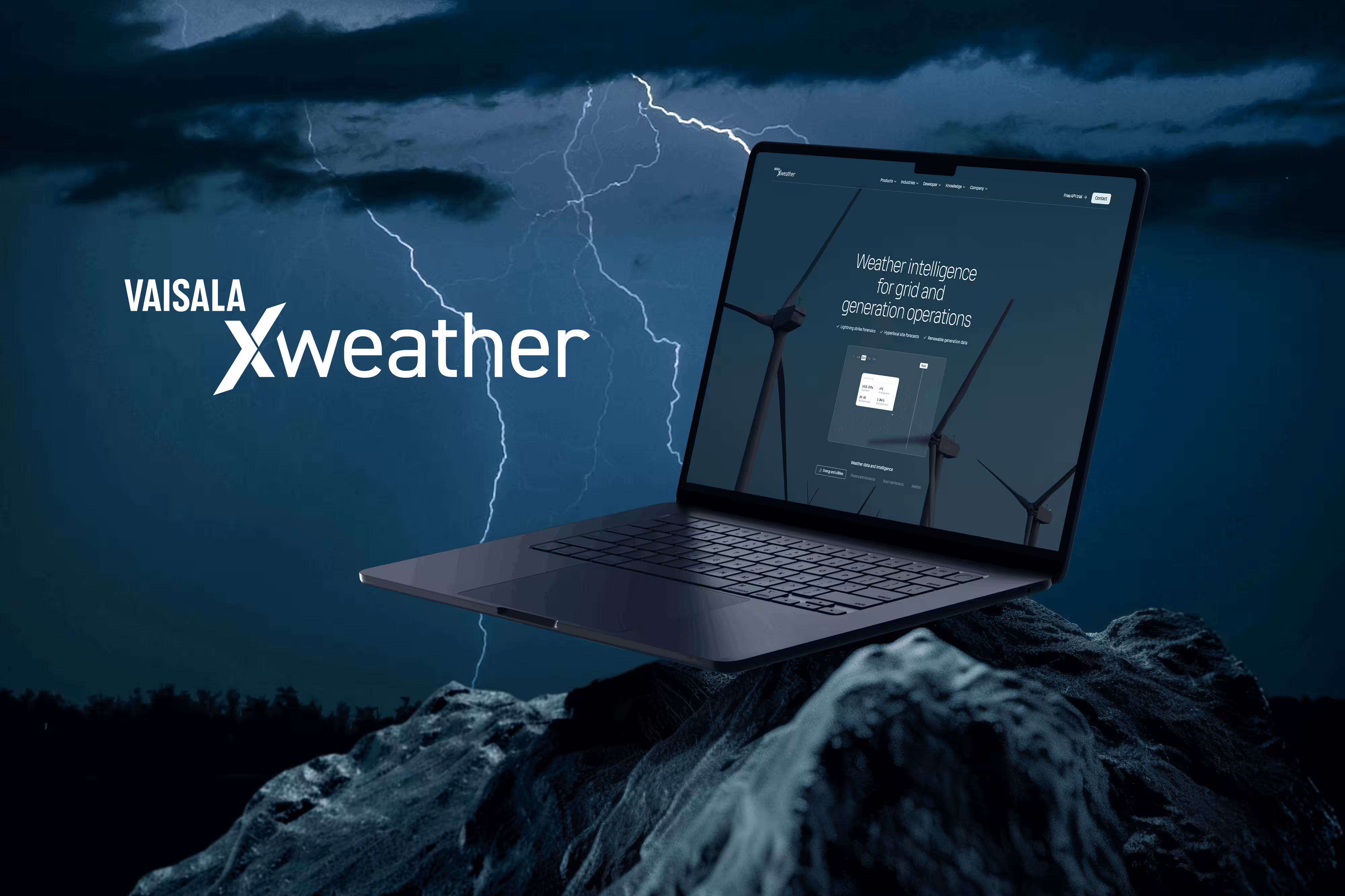 Laptop showing Vaisala Xweather site above stormy landscape with lightning and wind turbines in the background