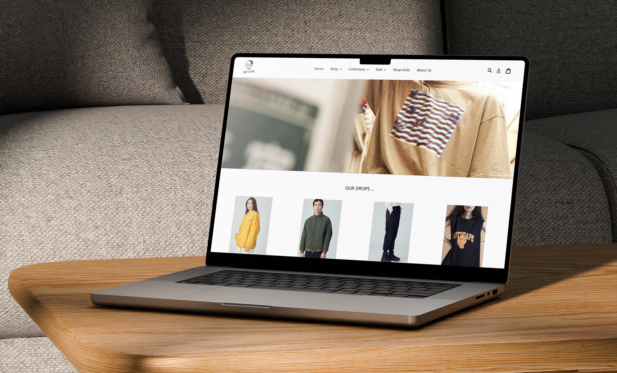 Laptop on couch showing e-commerce product listing page